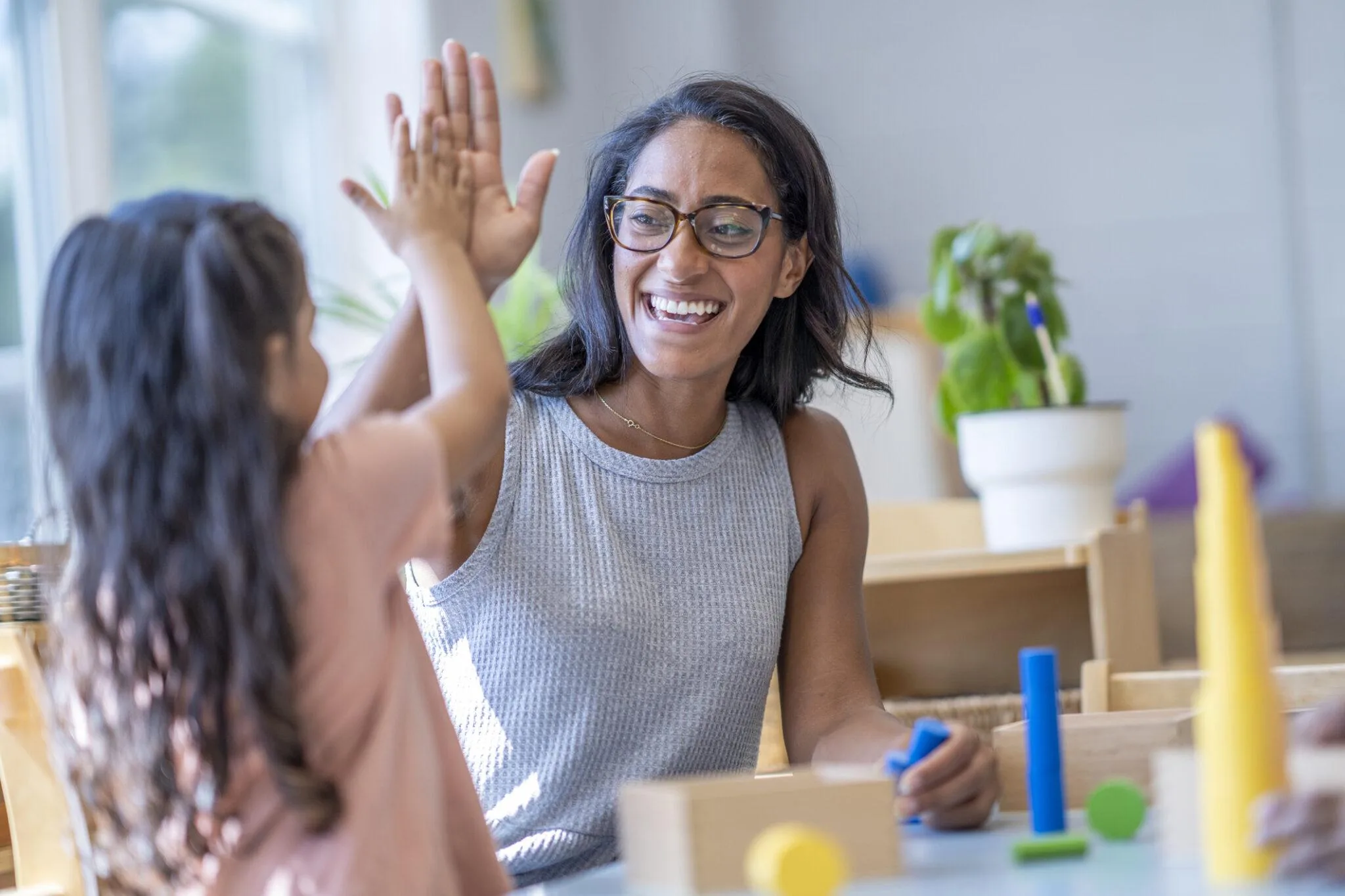 Teacher giving student high five