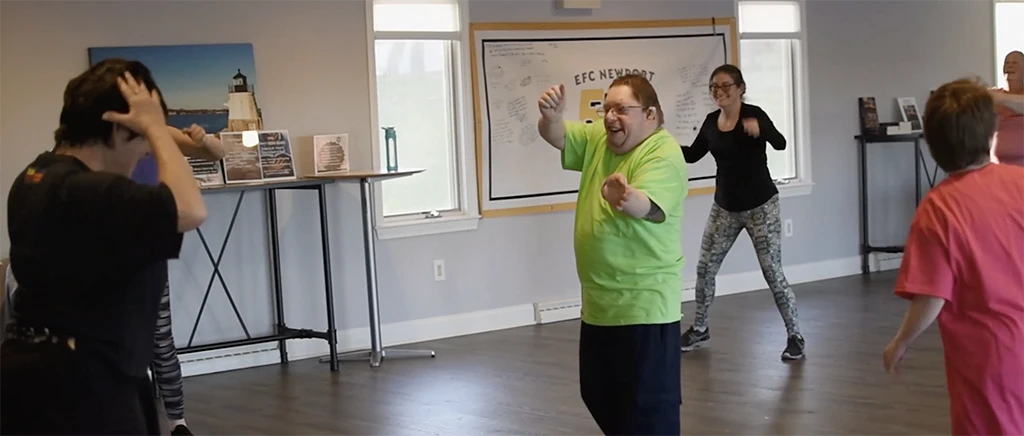 Young man enjoys Zumba at local church