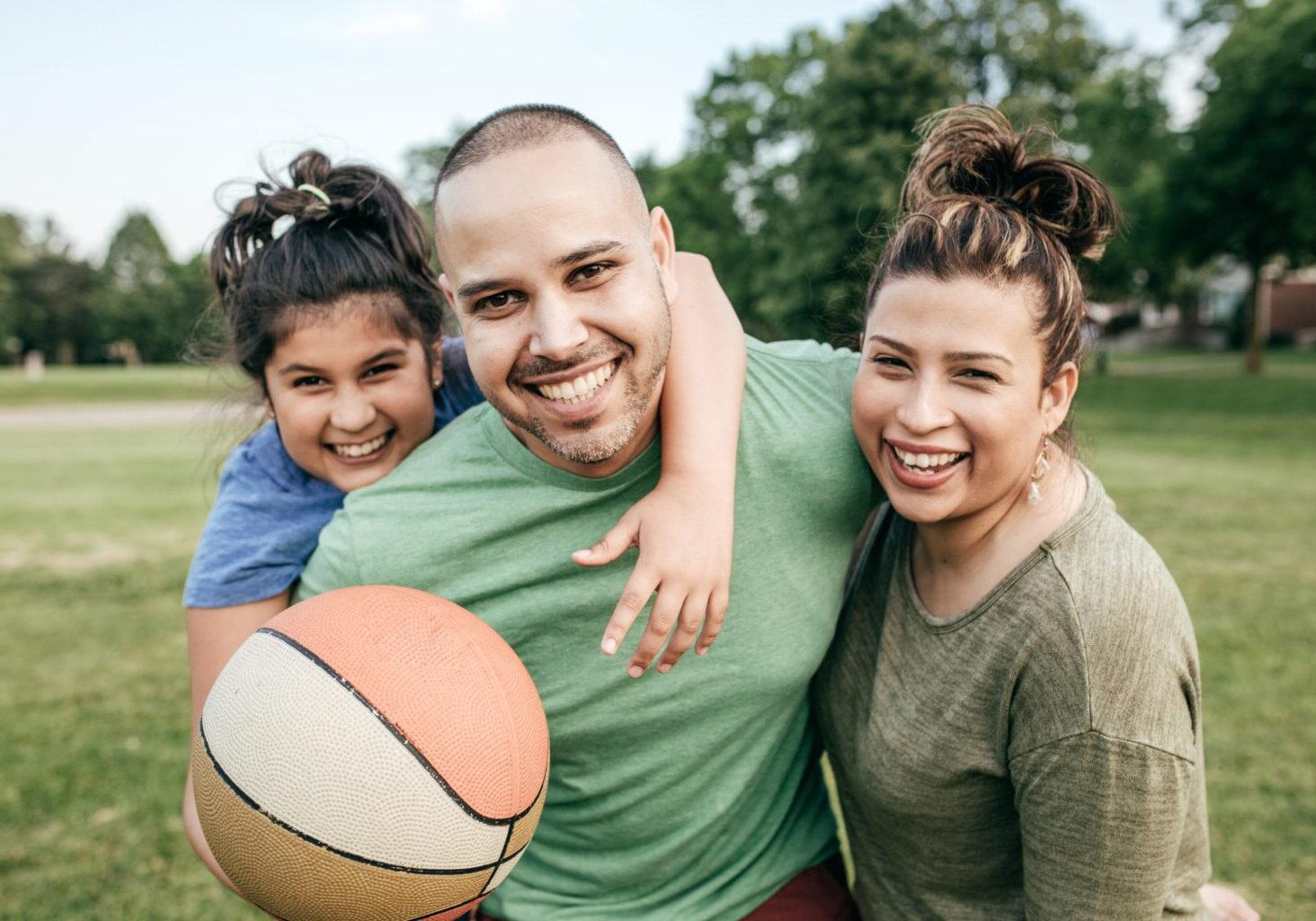 Children, Youth & Families Services Link - Photo shows daughter, father, and mother play ball in the park